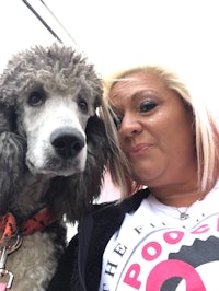 a woman with a poodle and a t - shirt